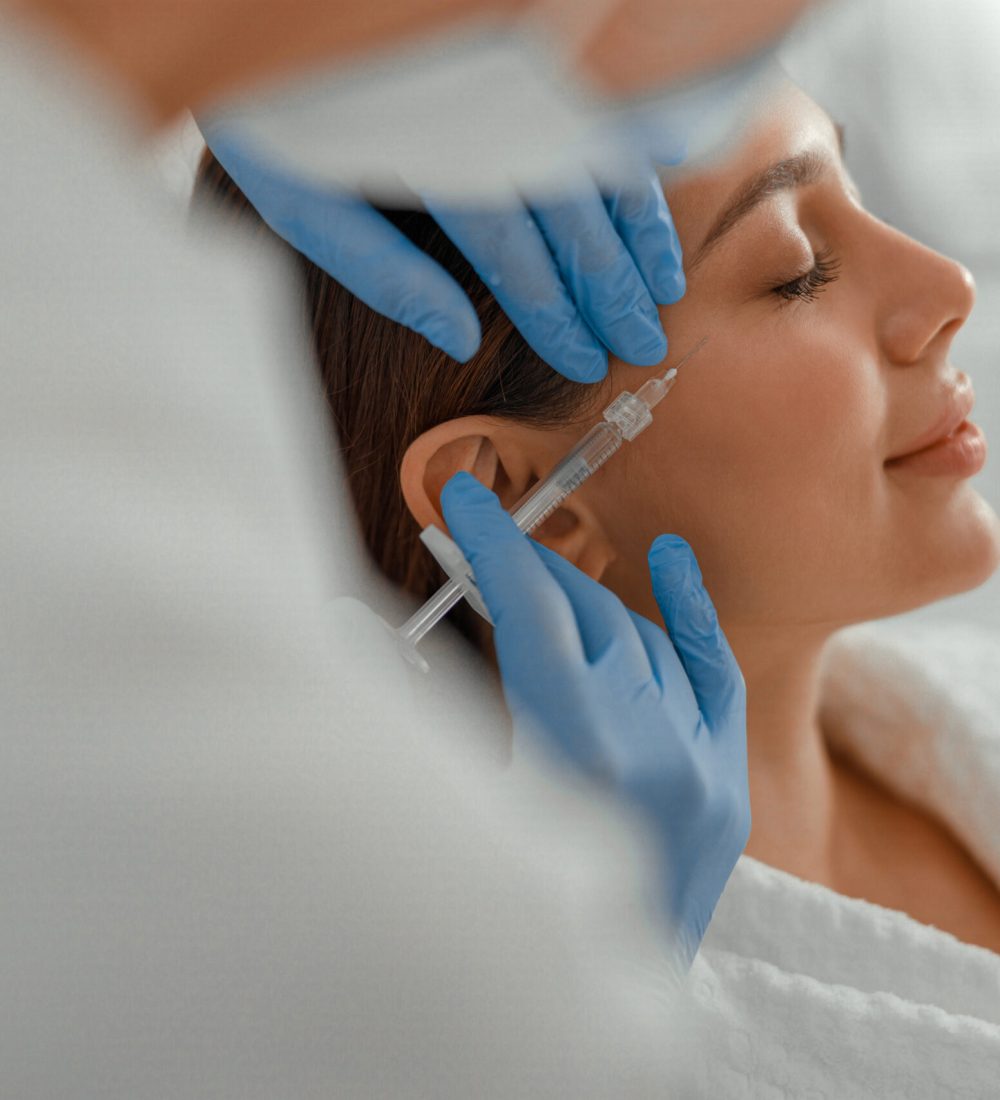 Beautiful healthy smiling caucasian woman is doing beauty procedures at spa and healthcare salon